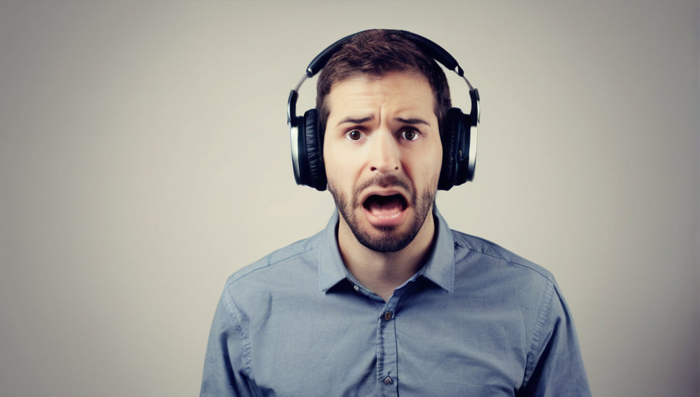 A man wearing headphones not knowing how to hear Gods voice