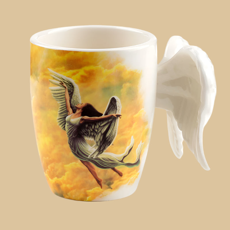 A coffee mug with Angel Wings as a handle